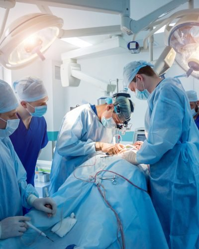 Spinal surgery. Group of surgeons in operating room with surgery equipment. Spinal surgery. Group of surgeons in operating room with surgery equipment. Laminectomy. Modern medical background